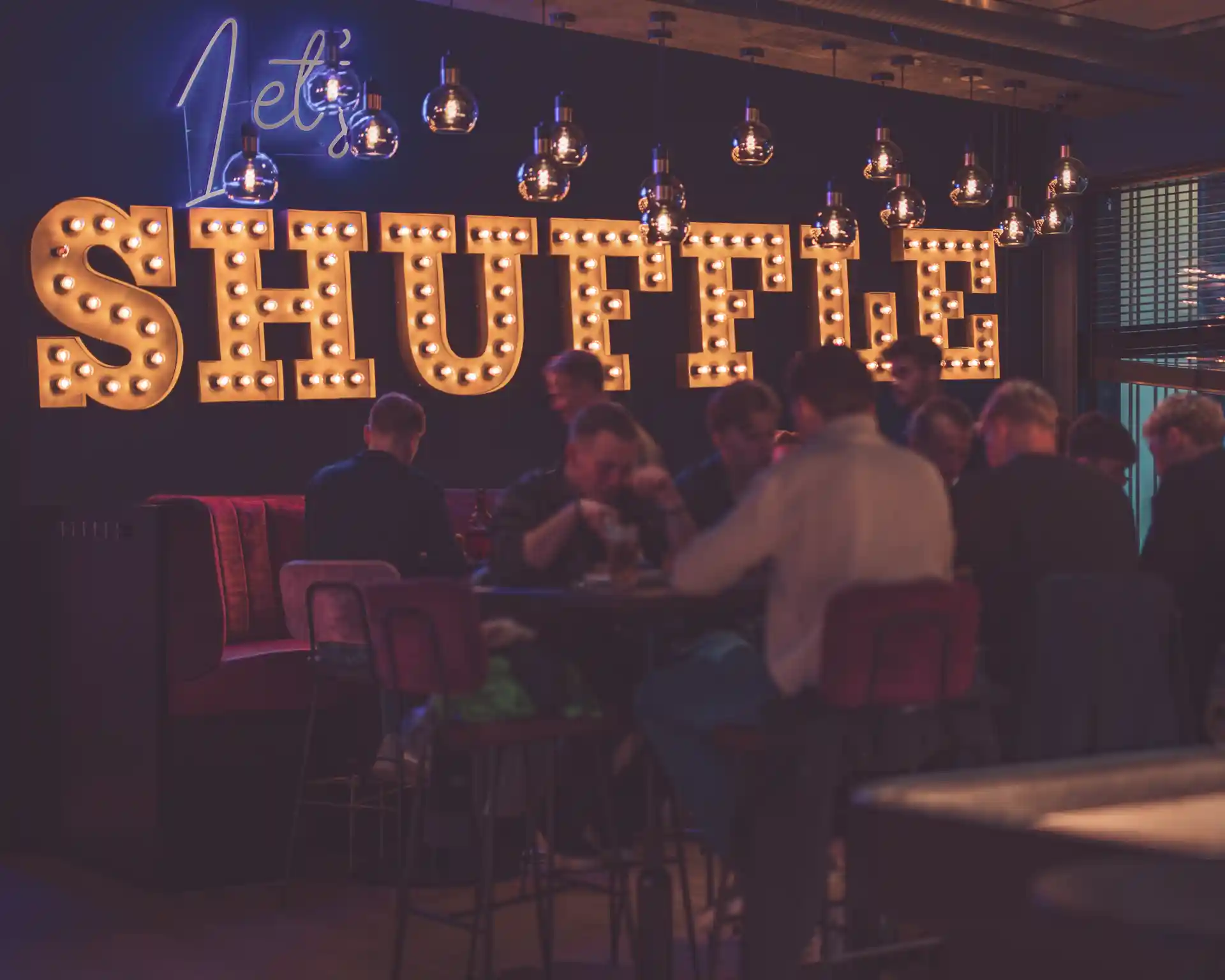 Shuffle board sign at wall.